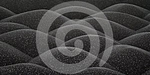 Black sand dune texture creates abstract patterns and dark, minimal, surface