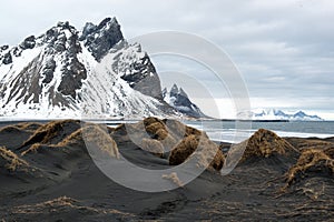 Black sand dunes and Vestrahorn mountain, ocean shore on the Stokksnes Peninsula, Iceland