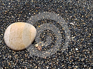 A stone on the sand.