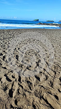 Black sand in Watu Ulo beach
