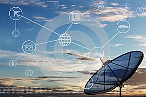 Black Satellite dish on twilight background.