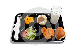 A black school lunch tray on a white background