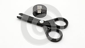 Black scissors with and black pencil sharpener a small size