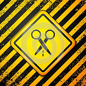 Black Scissors with cut line icon isolated on yellow background. Tailor symbol. Cutting tool sign. Warning sign. Vector