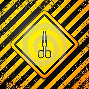 Black Scissors icon isolated on yellow background. Tailor symbol. Cutting tool sign. Warning sign. Vector