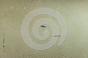 Black scuff marks on tan vehicle dashboard