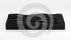 A black sculpture of a wave-like pattern. photo