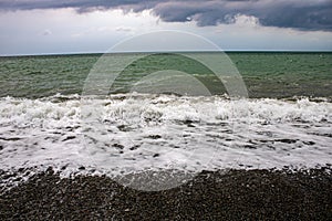 The Black Sea before an approaching storm on a hot sunny day with the clearest sea water in Sochi Loo