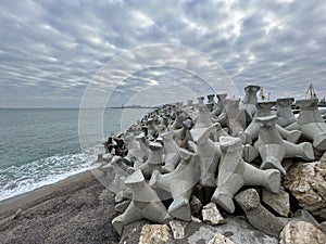 The Black Sea coast in Constanta city, Romania with tetrapods to protect the city