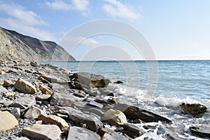 the Black Sea. The outskirts of Anapa. Mountains and rocks, pebble beach.