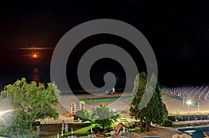 The Black Sea shore from Albena, Bulgaria in night time moon