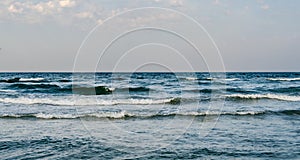 The Black Sea shore, water waves, blue sky