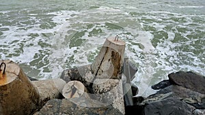 Black Sea waves break about pier with stones