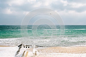 black sea in winter. seagulls fly in the sky.