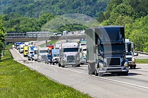 Black Semi Truck In Heavy Interstate Traffic