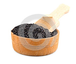 Black sesame in a Cup and spoon isolated on white background