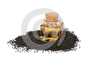 Black sesame Seeds and oil isolated on white surface