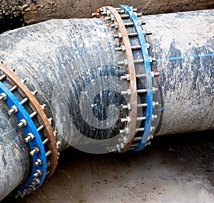 Black sewer pipe with bolt clamp