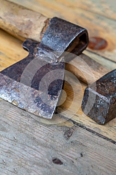 Black sharp ax close-up on background  hammer big heavy on wooden boards design tool