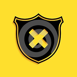 Black Shield and cross x mark icon isolated on yellow background. Denied disapproved sign. Protection, safety, security