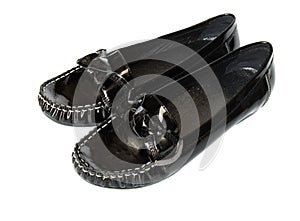 Black shiny moccasins isolated on white background photo