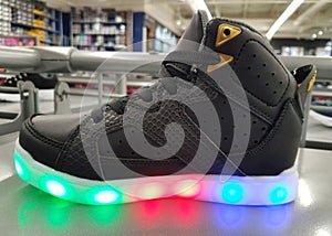 A black shoe with light up soles