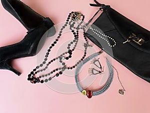 Black shoes on high heels and black leather clutch bag fashion pink leather handbag and summer stylish shoes living coral jewelry