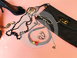 Black shoes on high heels and black leather clutch bag fashion pink leather handbag and summer stylish shoes living coral jewelry