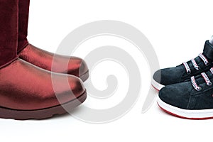 Black shoes for son and red ones for mom as filiation concept