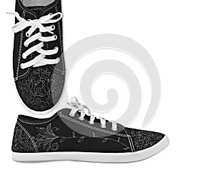 Black shoes with white laces and floral pattern
