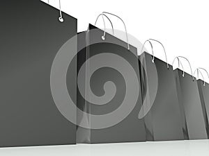 Black shopping bags row, background