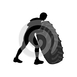 Black silhouette of athletic men carring big heavy tyre