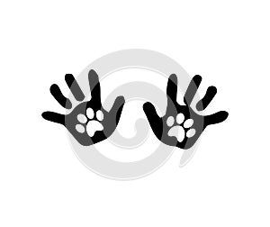 Black silhouette of baby hand prints with animal pawprints inside photo