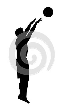 Black silhouette of a basketball player who jumped and threw the ball forward with two hands