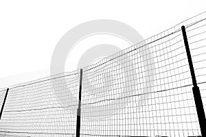 black silhouette of Chain link fence. Metal Wire Fence. Wire grid construction. High net fence with barbed wire, concrete pole,