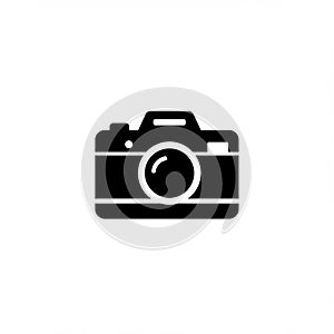 Black silhouette of a classic camera on a white background. Features include a round