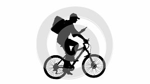 Black silhouette of delivery man with portable backpack talking on smartphone riding a bicycle isolated on white