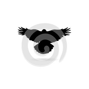 Black Silhouette of a flying crow isolated on white icon or logo