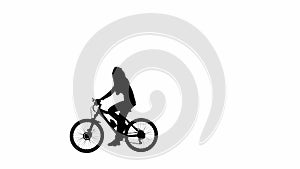 Black silhouette of girl talking on smartphone riding a bicycle. Isolated on white background with alpha channel