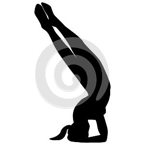 A black silhouette of a healthy woman doing yoga