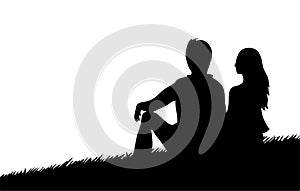 Black silhouette of a man and a girl on the grass