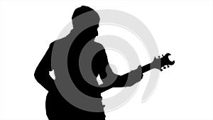 Black silhouette of a man playing the guitar on a white background