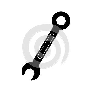 Black silhouette a metallic wrench