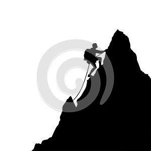 black silhouette of a Mountaineer scaling a cliff