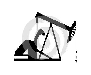 Black silhouette of an oil pump jack isolated on white background