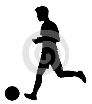 Black silhouette of a school football boy player in profile runs after the ball