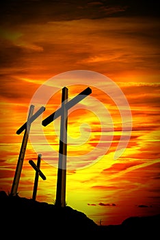 Black Silhouette of Three Crosses at Sunset