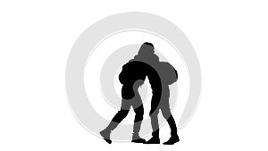 Black silhouette of young woman and man in sportswear with backpacks greeting each other, hugging friendly. 2 in 1