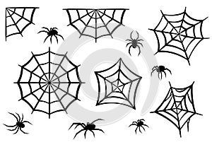 Black silhouettes of spiders and spider webs. Halloween elements isolated on white background. Vector illustration photo