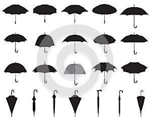 Black silhouettes of umbrellas